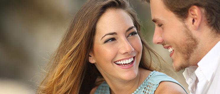 young couple smiling at each other